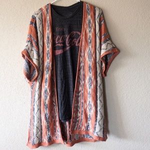 Old fashion Coca Cola T-shirt and open cardigan